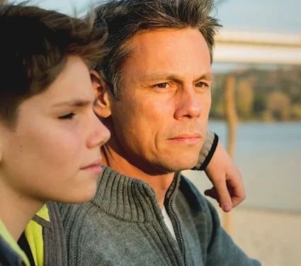 Father and his child impacted by cancer Father and his child impacted by cancer